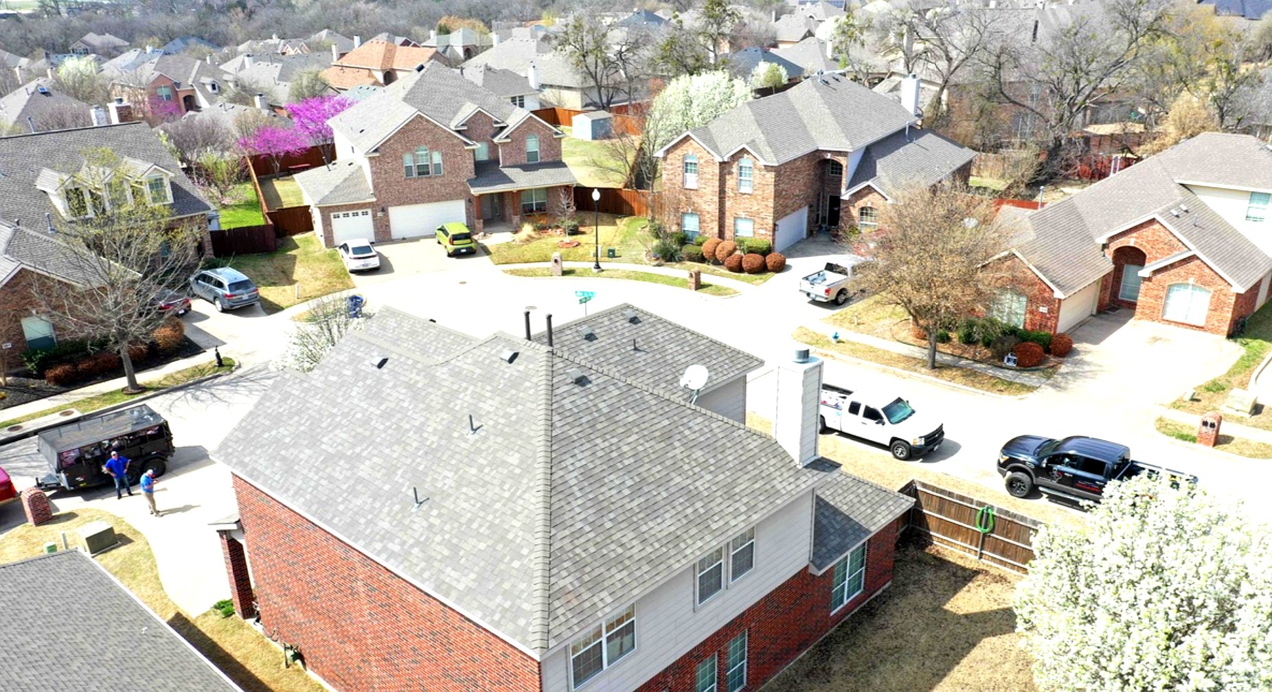 top of home shown from drone with grey roof