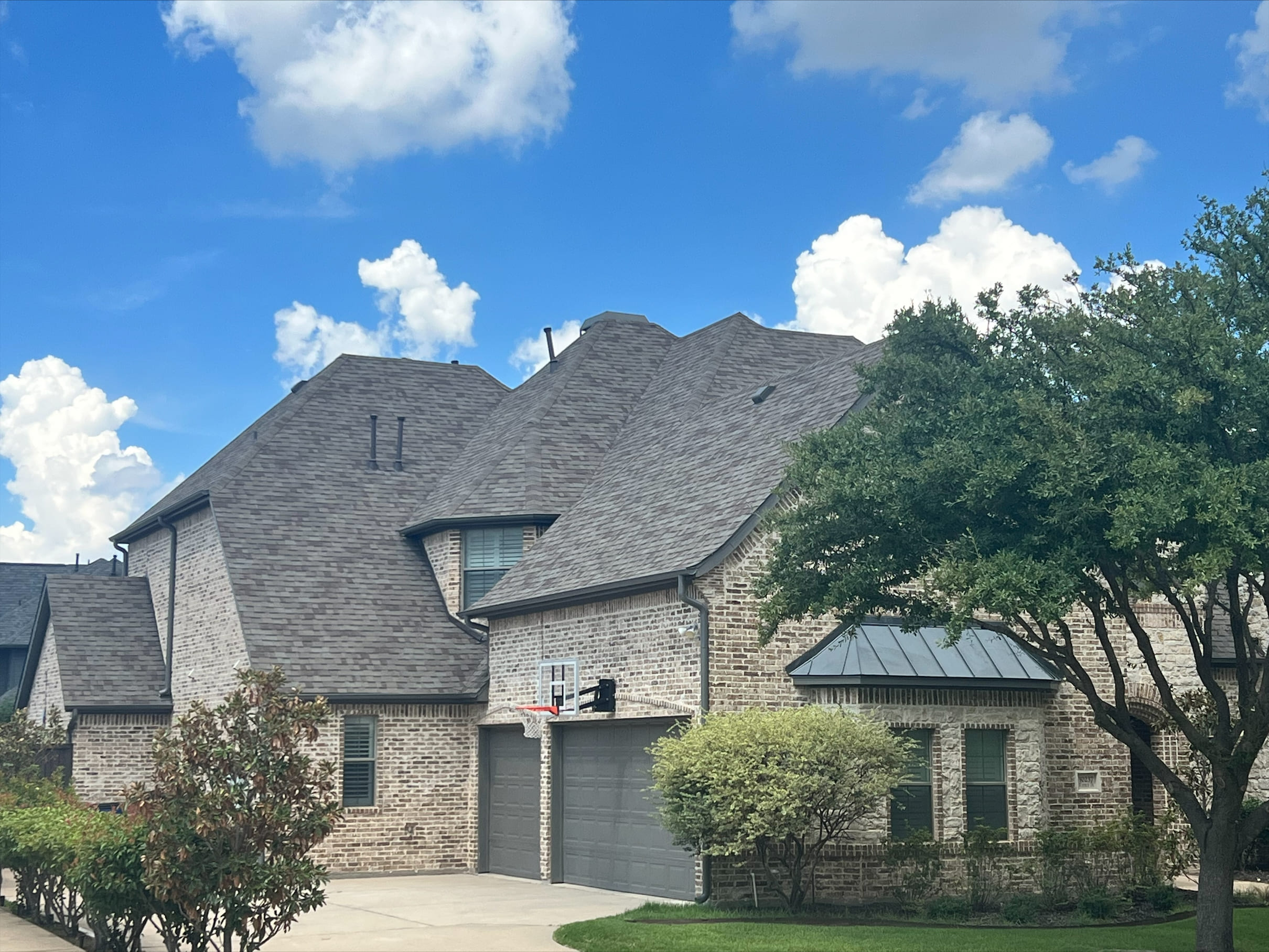 Finished house roof project by Cook DFW